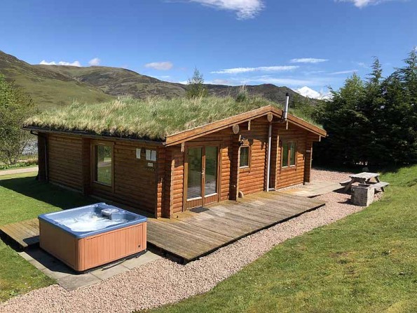 Prehistoric Coping Excrete Log cabins with hot tubs in the Cairngorms