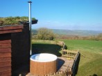 Relax in the wood-fired hot tub and enjoy the views