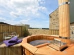 A relaxing dip in the wood burning hot tub A relaxing dip in the wood burning hot tub