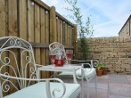 Enjoy a sit in the sun in private enclosed patio area