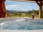 Relax in the hot tub and enjoy the beautiful views