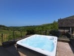 Decked area with hot tub Decked area with hot tub