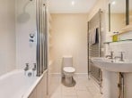 Bathroom with shower over bath Bathroom with shower over bath