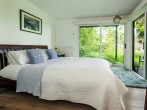 Master bedroom with views of the wood