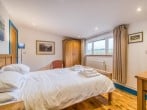 Ground floor bedroom with king-size bed and en-suite shower room Ground floor bedroom with king-size bed and en-suite shower room