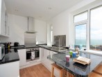 Lovely light kitchen with sea views