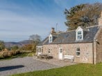 Charming cottage with fully enclosed gardens and views over the Cairngorms Charming cottage with fully enclosed gardens and views over the Cairngorms