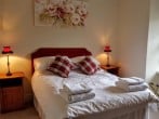 Double bedroom with views over the walled garden and beyond Double bedroom with views over the walled garden and beyond