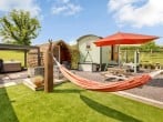 Relax on the hammock or in the hot tub Relax on the hammock or in the hot tub