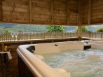Enjoy a dip in the housed hot tub with viewing gallery to admire the views