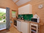 The little kitchen is cleverly fitted and is perfect for cooking a light supper