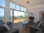 Fabulous beachside apartment with bi-folding doors looking straight out to sea