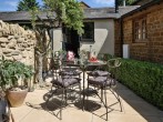 Relax in the courtyard which has shared access