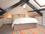 A romantic clog loft bedroom with a large floor space but restricted height A romantic clog loft bedroom with a large floor space but restricted height