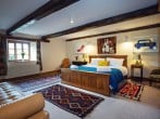 Exposed beams and colourful textiles Exposed beams and colourful textiles