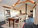 Welcoming, open-plan interior with a warming wood burner
