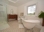 Sumptuous family bathroom with roll top bath, separate shower and WC