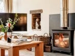 Relax in front of the wood burner after a day out Relax in front of the wood burner after a day out