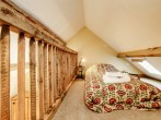 The single bed on the mezzanine level completes the family room  