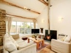 The wood burner enhances the spacious living area The wood burner enhances the spacious living area