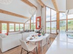Wonderful open-plan lounge/kitchen/diner area with views and cosy wood burner