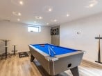 Games room located below the swimming pool Games room located below the swimming pool