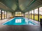The indoor pool with exclusive use which  is heated and overlooks the farmland 