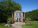 The gardens feature a summer house The gardens feature a summer house