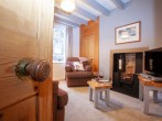 Enter the living room with characterful cast iron fireplace