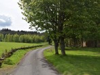 The approach to the lodge surrounded by splendid countyside and woodland