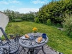 Enclosed garden leading to the 5-acre field with sea views in the far distance Enclosed garden leading to the 5-acre field with sea views in the far distance
