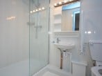 The bright en-suite shower room The bright en-suite shower room