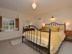 Head upstairs to the light and airy king-size bedroom