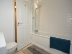 Bathroom with bath, shower over and WC