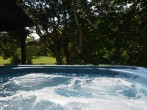 Relax in the large hot tub on the deck