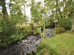 Enjoy the babbling brook that passes the lodge