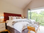 The luxurious super-king-size bedroom with Smart TV and Juliet balcony