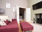 Sit on the comfy sofa, enjoy a movie on the Smart TV and relax in front of the wood burner