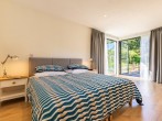 Beautiful master super-king-size bedroom with seating overlooking the garden Beautiful master super-king-size bedroom with seating overlooking the garden