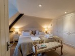 A stylish and cosy twin bedroom