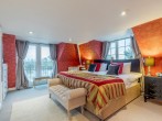 A super-king-size bedroom with river views