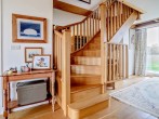 Solid wooden staircase to the first floor