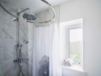 A ground floor shower room with rainwater shower and WC