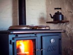 The wood burning stove and kettle
