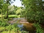 The river running alongside the estate The river running alongside the estate