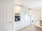 Utility Room with fridge/freezer and built in coffee machine Utility Room with fridge/freezer and built in coffee machine