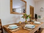 Enjoy a formal dinner or quick lunch at the dining table Enjoy a formal dinner or quick lunch at the dining table