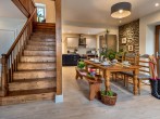 Exposed stone walls and original wooden staircase