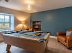 Take full advantage of the well-equipped games room with pool table