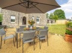 Enjoy alfresco dining in the lawned garden Enjoy alfresco dining in the lawned garden